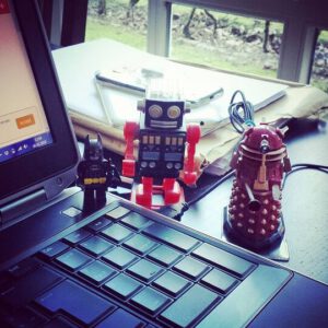 robot toys near an open laptop