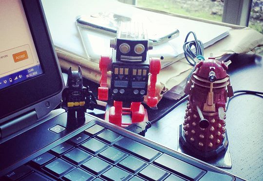 robot toys near an open laptop