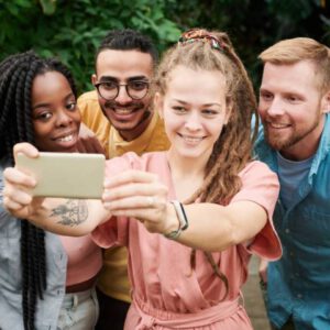 four people taking a selfie