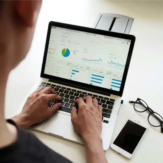 a man conducting an seo audit on his laptop.