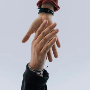 two hands reaching out and clasping each other