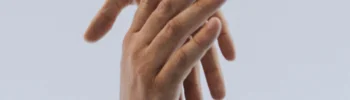 two hands reaching out and clasping each other