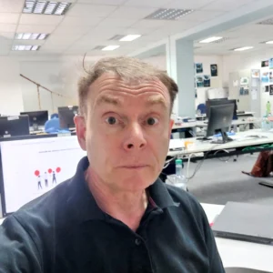 Warren Laine-Naida in the office not happy about conducting an seo audit - humourful image