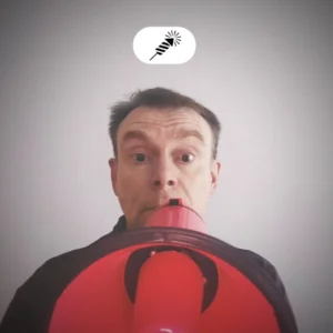 Warren Laine-Naida speaking with a megaphone