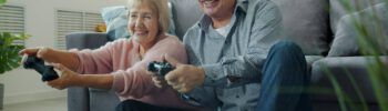 elderly couple playing video games