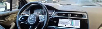 inside of a waymo car driving down the street