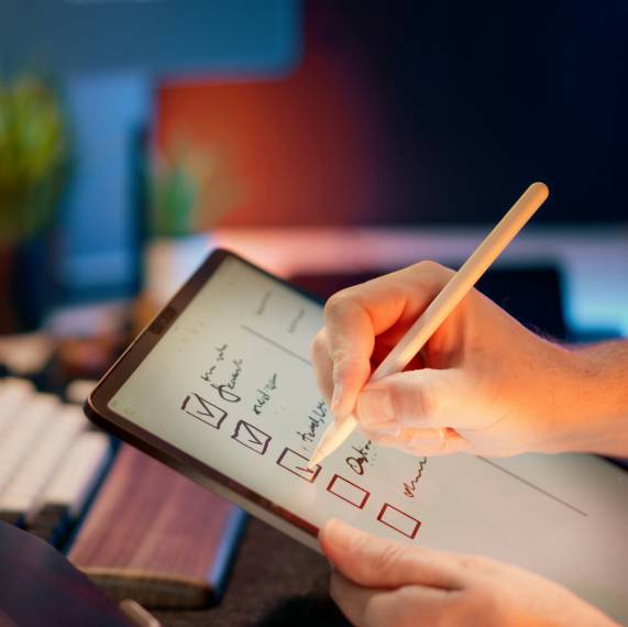ticking off a list on a tablet